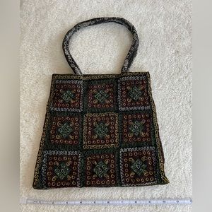 Embroidered, beaded on black ornate handbag